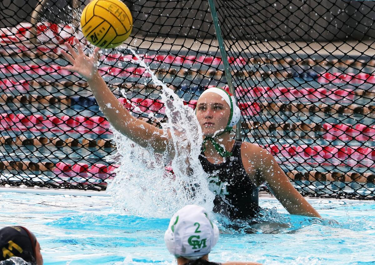 Costa Mesa's goalie Maggie Kirby (1) leaps for the save against Estancia during the Battle for the Bell match.