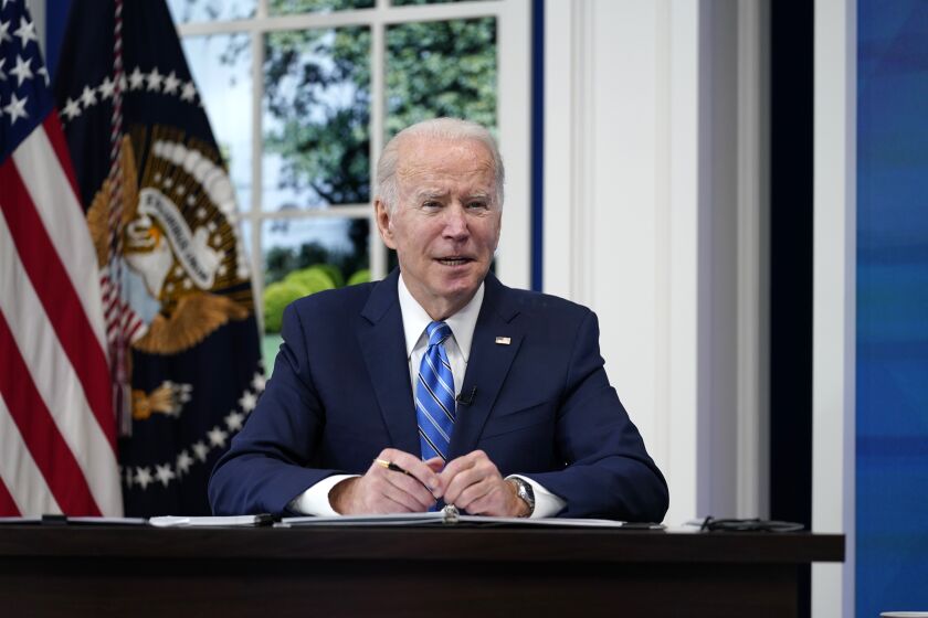 President Joe Biden participates in the White House COVID-19 Response Team's regular call with the National Governors Association in the South Court Auditorium in the Eisenhower Executive Office Building on the White House Campus, Monday, Dec. 27, 2021, in Washington. (AP Photo/Carolyn Kaster)