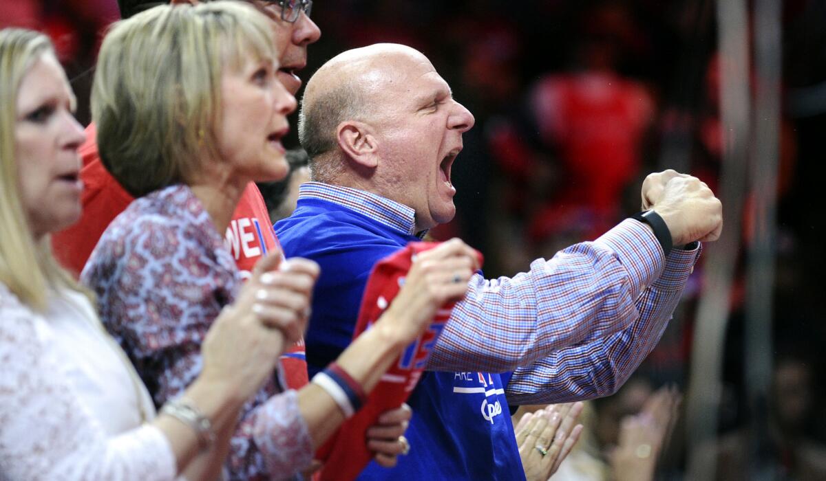 Clippers owner Steve Ballmer cheers for his team against the Spurs in Game 5 of a first-round playoff series on Tuesday night at Staples Center.