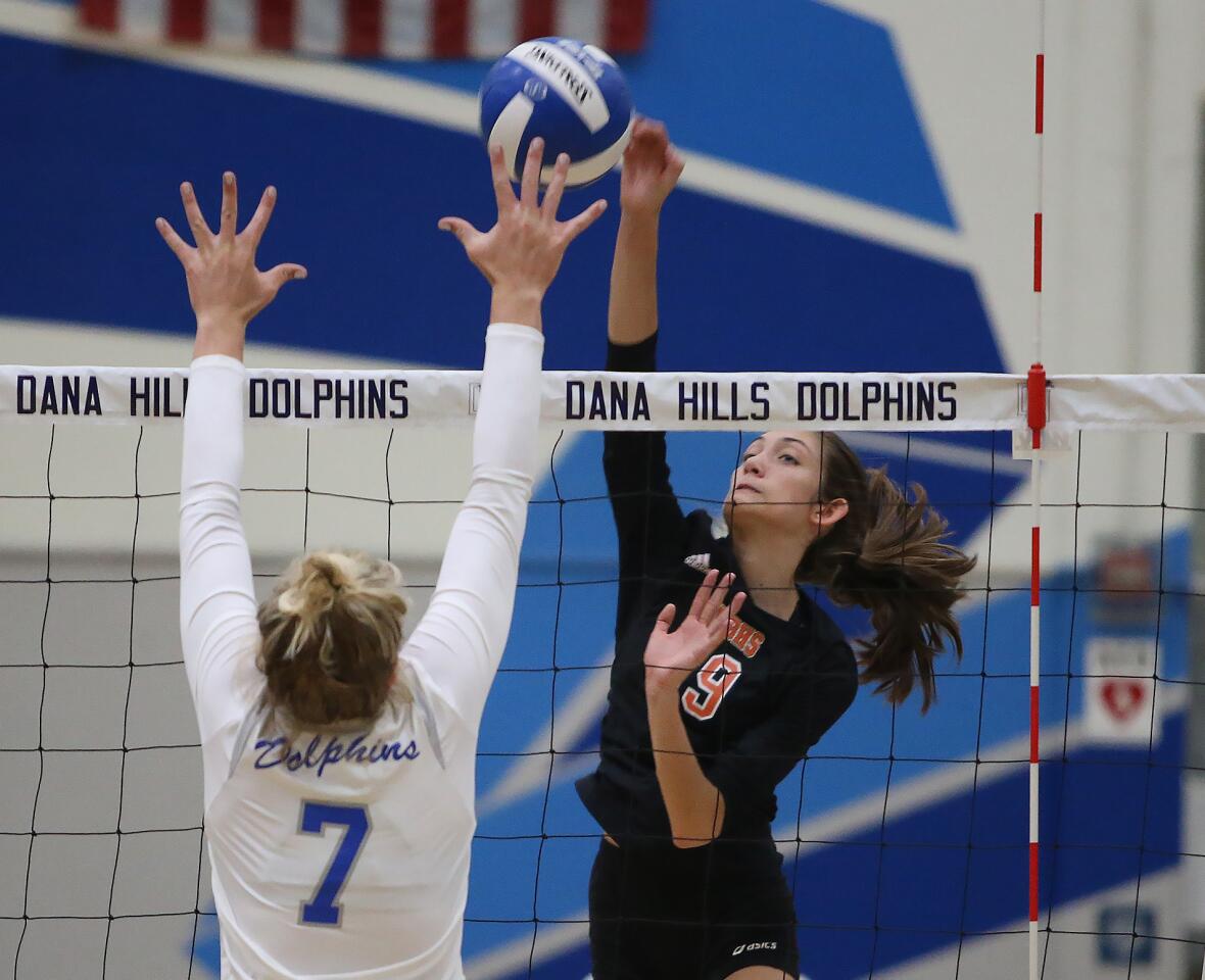 Huntington Beach High's Sabrina Phinizy hits from the outside during the second round of the CIF Southern Section Division 2 girls' volleyball playoffs against Dana Hills on Saturday.