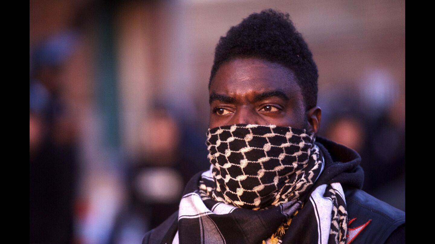 A motorcycle group, including this man, formed a line in front of Baltimore riot police the night after citywide riots over the death of Freddie Gray.