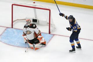 St. Louis Blues' Jake Neighbours (63) celebrates after scoring past Anaheim Ducks goaltender Lukas Dostal (1) during the third period of an NHL hockey game Sunday, March 17, 2024, in St. Louis. (AP Photo/Jeff Roberson)