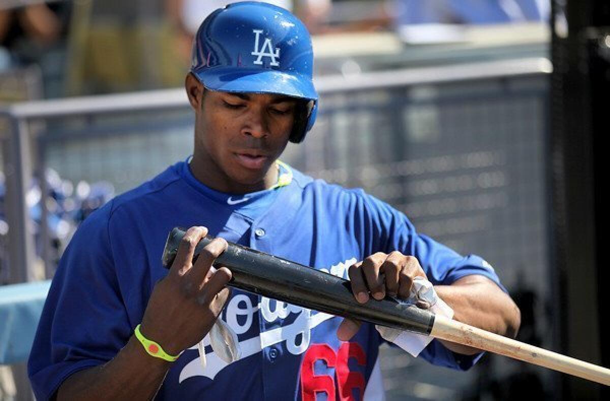 Dodgers rookie outfielder Yasiel Puig gets ready for batting practice on Wednesday evening at Dodger Stadium.