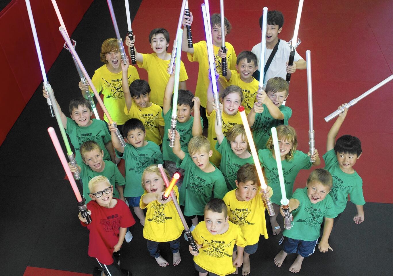 This group of 21 children, ages 5-13, took part in United Studios of Self Defense's five-day Light Saber Academy, held from July 20-24.