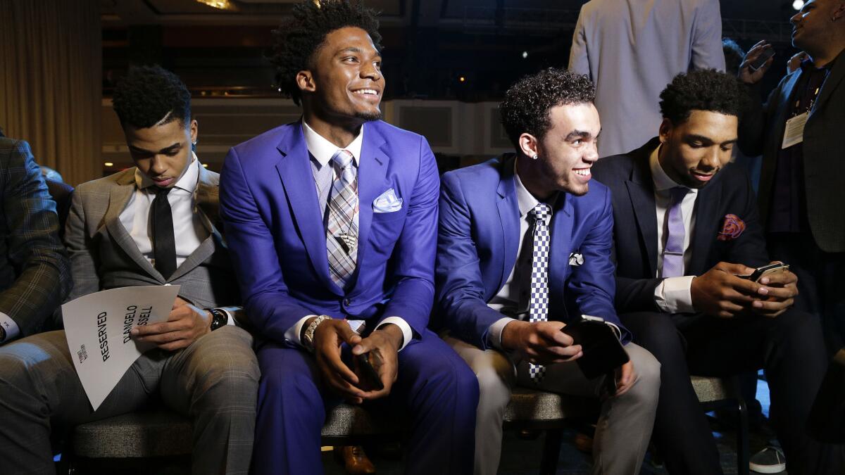 NBA draft prospects (from left) D'Angelo Russell, Justice Winslow, Tyus Jones and Jahlil Okafor wait for the start of the draft lottery in New York on Tuesday.