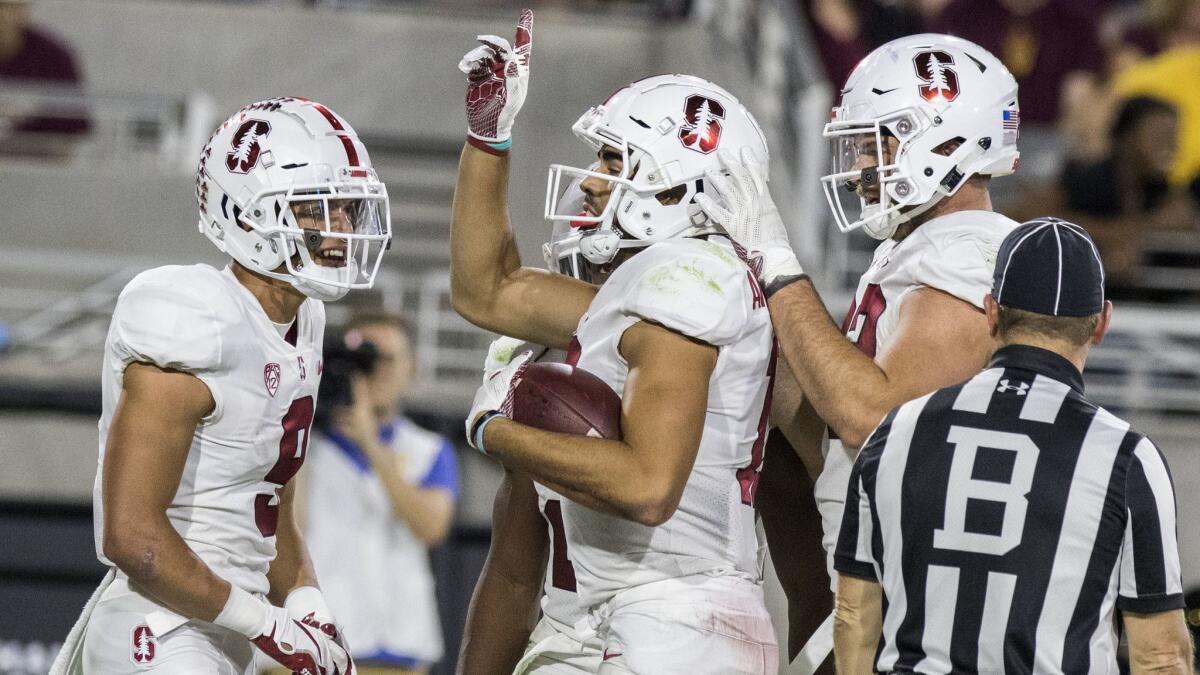 Stanford's JJ Arcega-Whiteside celebrates his touchdown against Arizona State with teammates during the second half.