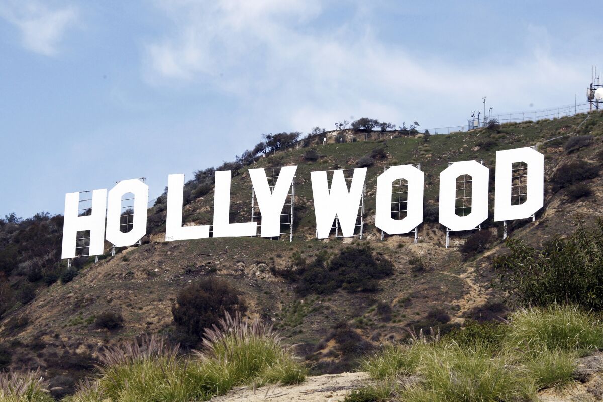 A sign on a hill spells out the word 'Hollywood'