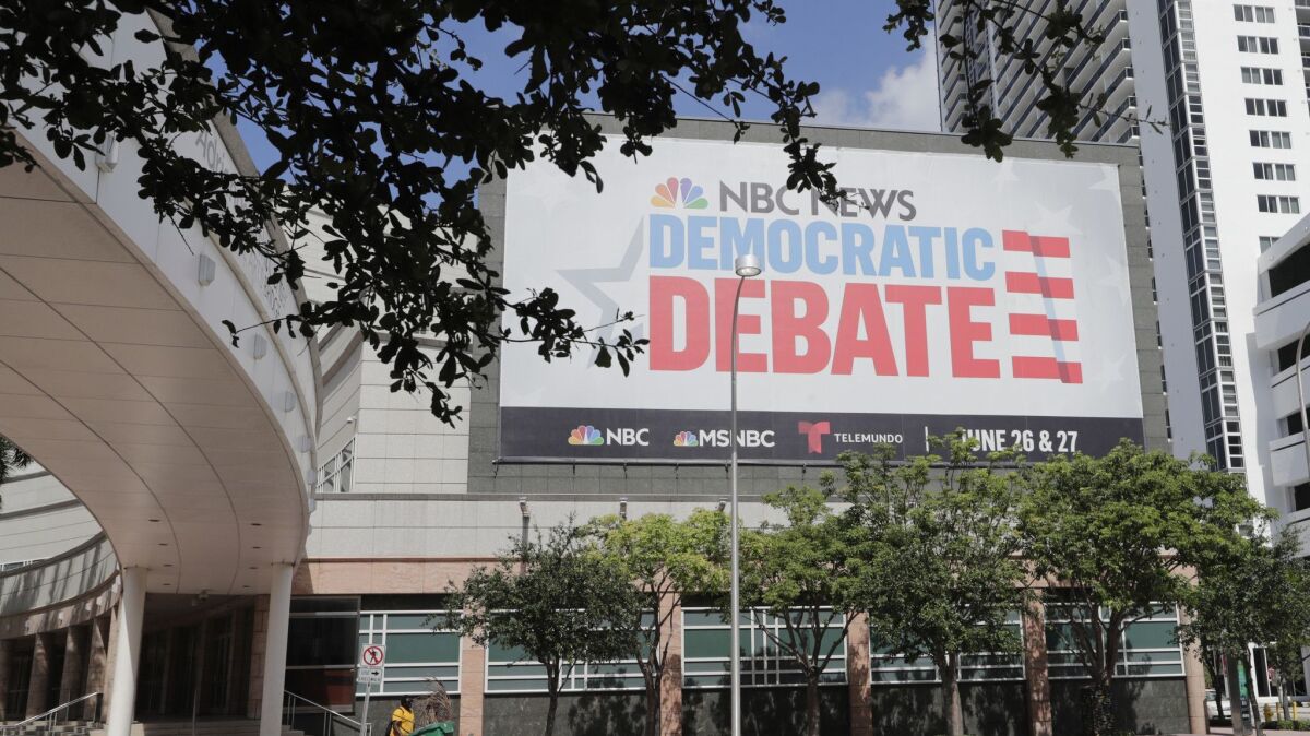 A billboard in Miami on June 24 advertises the Democratic presidential debates.