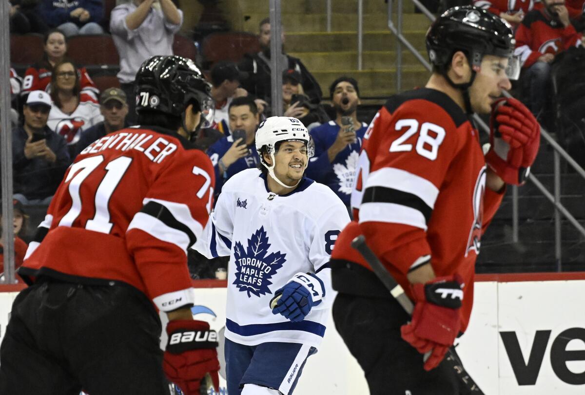 Toronto Maple Leafs left wing Nicholas Robertson (89) celebrates his goal during the first period of an NHL hockey game against the New Jersey Devils Tuesday, April 9, 2024, in Newark, N.J.(AP Photo/Bill Kostroun)