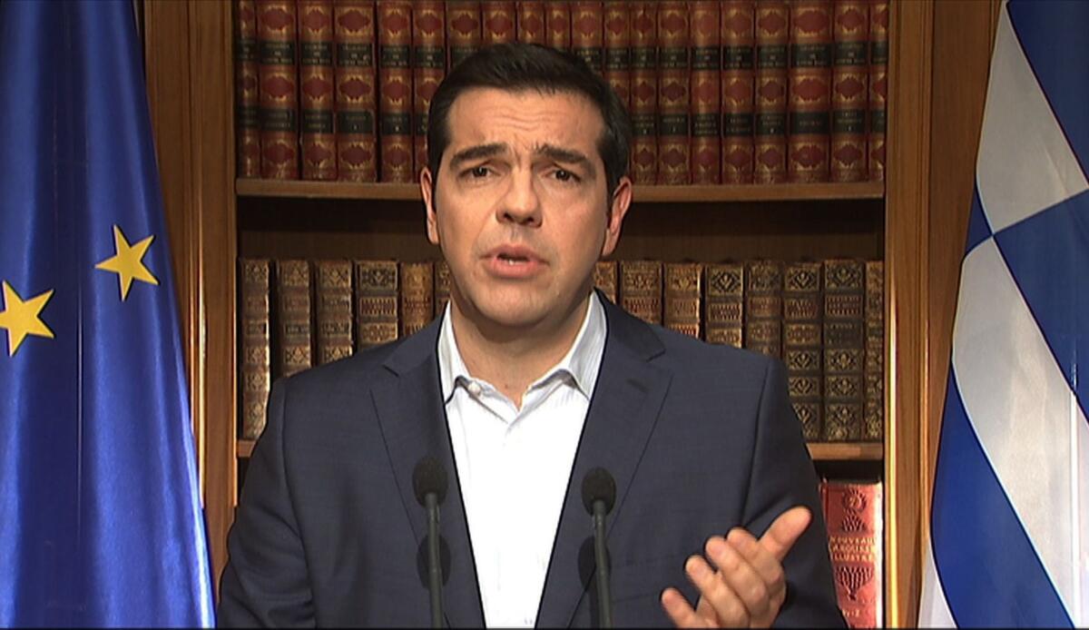 Greek Prime Minister Alexis Tsipras addressing the nation on television July 1, when he appeared to backtrack on refusal to accept creditors' terms for more bailout funds while continuing to urge Greeks to vote "no" on the proposals in a referendum set for the following Sunday.