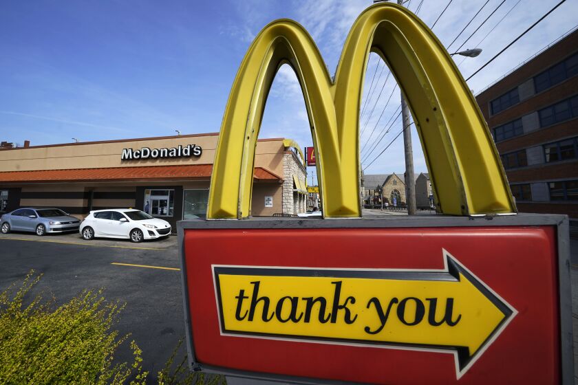 FILE - An exit sign is shown at a McDonald's restaurant in Pittsburgh on Saturday, April 23, 2022. McDonald's reports their earnings Tuesday, Jan. 31. (AP Photo/Gene J. Puskar, File)