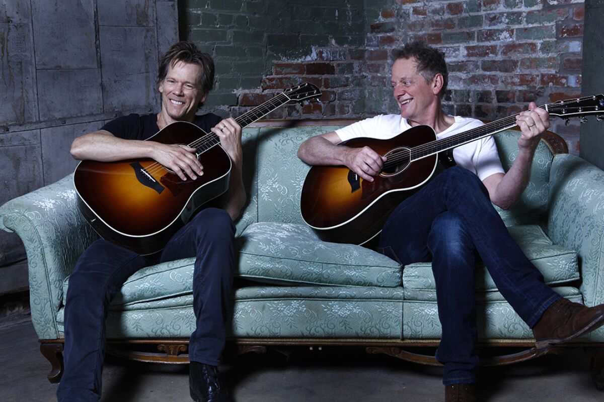  Kevin and Michael Bacon (right) have performed music together as the Bacon Brothers since 1995.