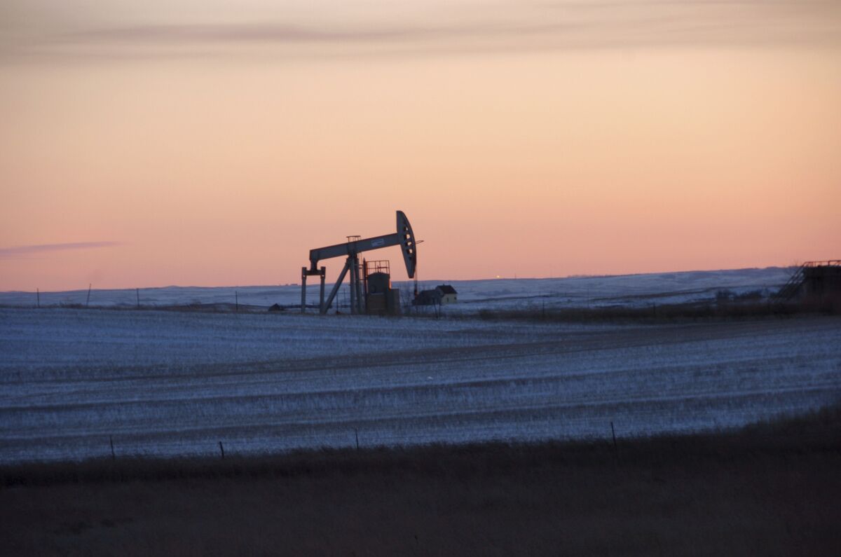 FILE - A pump jack for pulling oil from the ground is seen near New Town, N.D., Feb. 25, 2015. On Monday, March 27, 2023, a federal judge ordered the United States government to resume oil and gas lease sales on federal lands in North Dakota as a legal battle continues over the Biden administration's pause on the federal leasing program two years ago in an effort to combat climate change. (AP Photo/Matthew Brown, File)