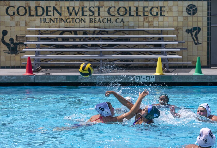 The Golden West College girls' water polo team practices Monday the first day of class.