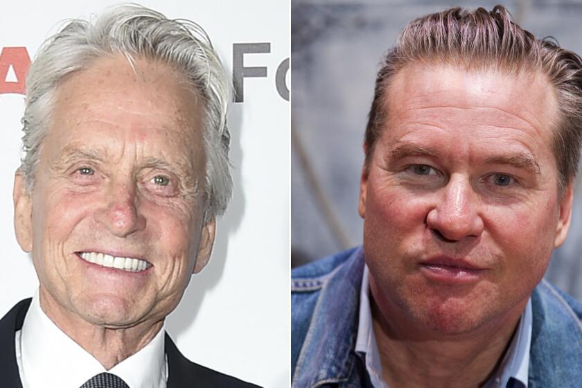 Michael Douglas, left, was "misinformed" about Val Kilmer's health, the "Top Gun" actor says.