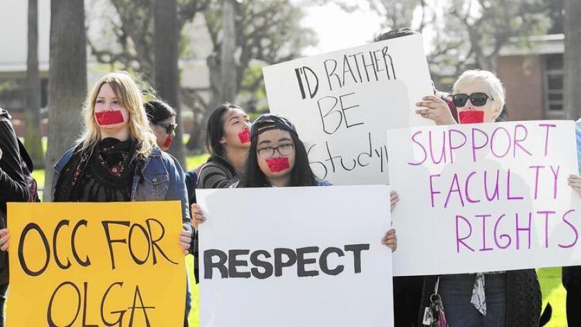 Students hold a silent demonstration on campus in support of Orange Coast College professor Olga Perez Stable Cox, who was recorded in class making controversial remarks about Donald Trump’s victory in the presidential election.