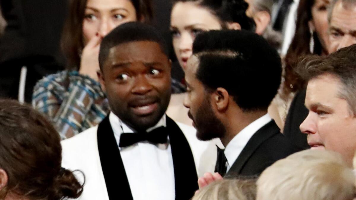 David Oyelowo, center, takes in the events.