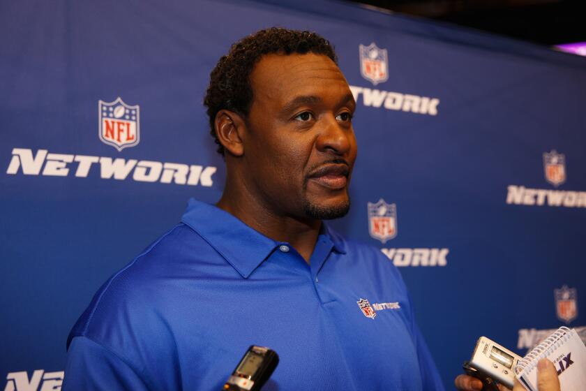 Former USC and NFL linebacker Willie McGinest, an NFL Network analyst, speaks with the media during Super Bowl media day in January.