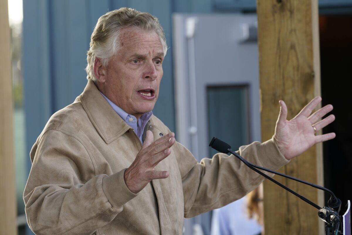 Democratic gubernatorial candidate former Gov. Terry McAuliffe, gestures as he speaks to supporters during a rally in Richmond, Va., Monday, Nov. 1, 2021. McAuliffe will face Republican Glenn Youngkin in the November election. (AP Photo/Steve Helber)