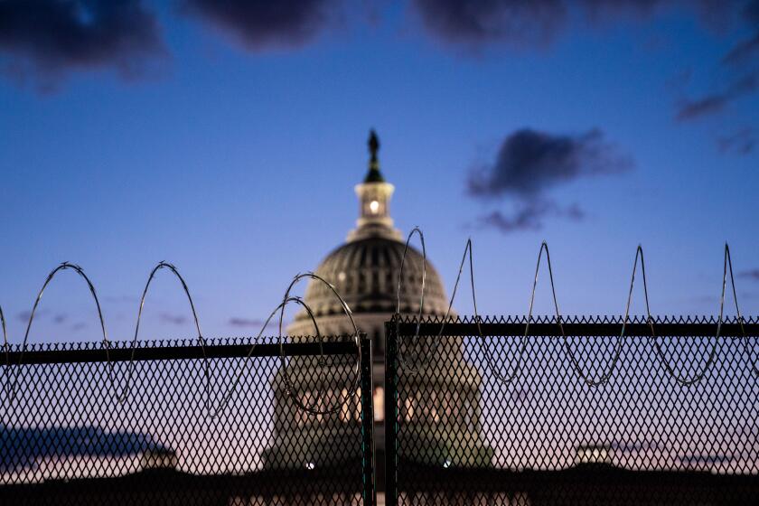 WASHINGTON, DC - MARCH 04: The U.S. Capitol Building, which saw boosted security, Thursday, after officials warned of an attack plot by extremists, two months after supporters of former president Donald Trump stormed the Capitol building is illuminated with the setting sun as the Senate debates the coronavirus relief package on Thursday, March 4, 2021 in Washington, DC. (Kent Nishimura / Los Angeles Times)