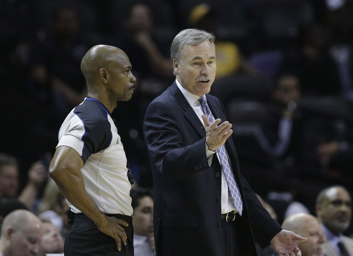 Lakers Coach Mike D'Antoni argues a call with a referee in the second half of Game 2 of the Lakers' first-round playoff series against San Antonio.