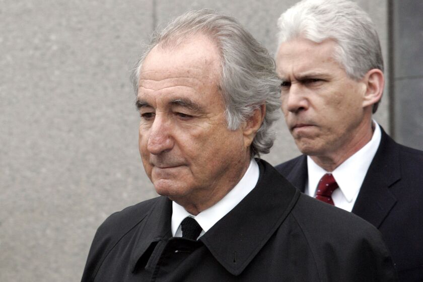 FILE - In this March 10, 2009, file photo, former financier Bernie Madoff exits federal court in Manhattan, in New York. The Supreme Court is leaving in place a lower court ruling that allows the trustee recovering money for investors in the Bernard Madoff Ponzi scheme to pursue more than $4 billion that went to overseas investors. The high court on Monday, June 1, 2020, declined to take the case. (AP Photo/David Karp, File)