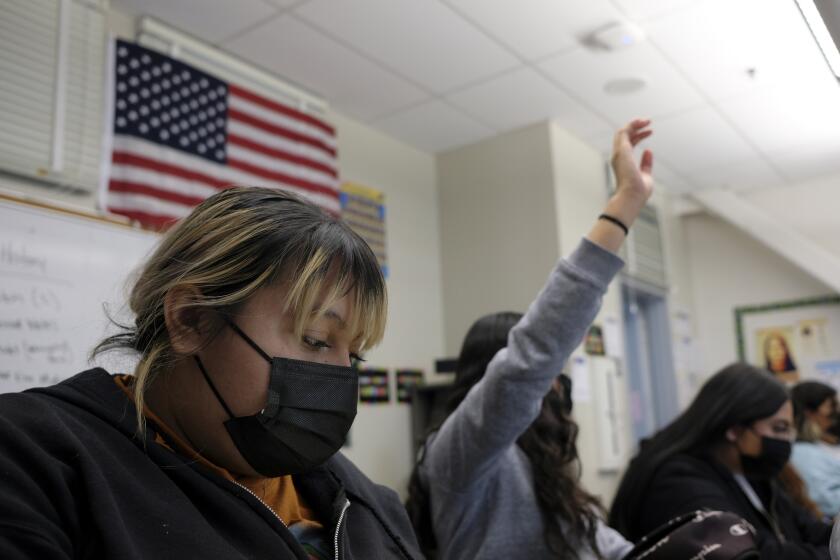 LOS ANGELES, CA - MARCH 02: Paula barcenas, 16, left, participates during a history class at Sotomayor Arts and Sciences Magnet on Wednesday, March 2, 2022 in Los Angeles, CA.The class today is focused on Ukraine and Russia. (Francine Orr / Los Angeles Times)