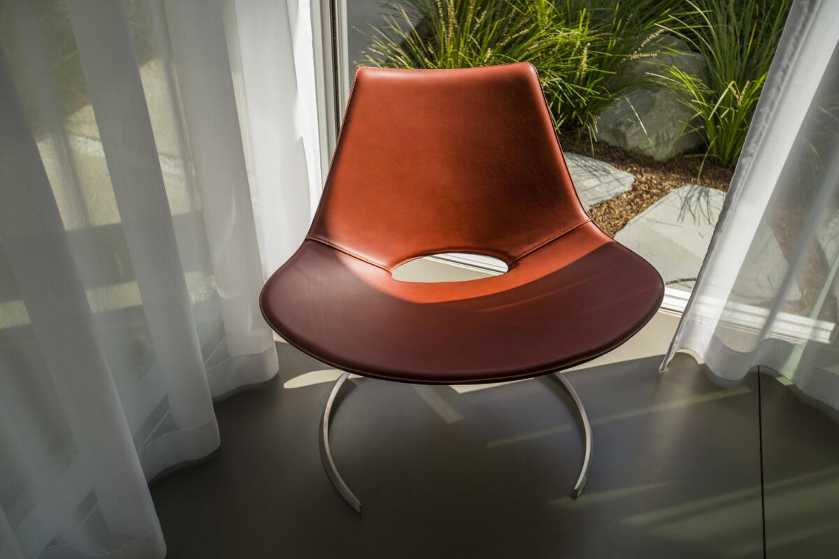 Named after the Turkish word for sword, the Scimitar reading chair was manufactured from original technical drawings from the 1960s, made in Denmark and stitched in Italy. (Allen J. Schaben / Los Angeles Times)