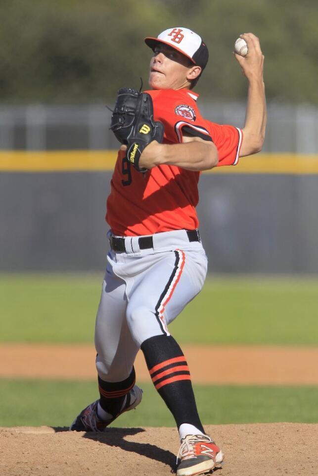 Huntington Beach High's Hagen Danner throws against Newport Harbor in a Sunset League game on Tuesday.