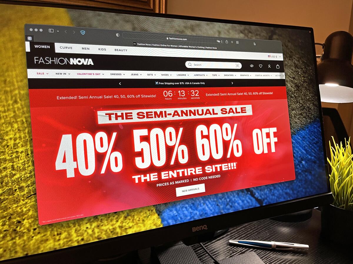 A computer is showing Fashion Nova's website. 