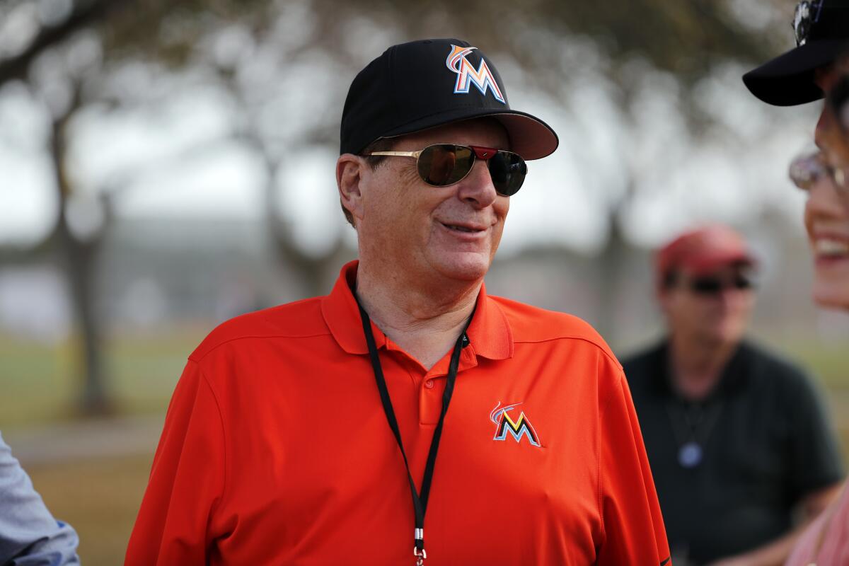Miami Marlins majority owner Bruce Sherman watches during spring training baseball practice.