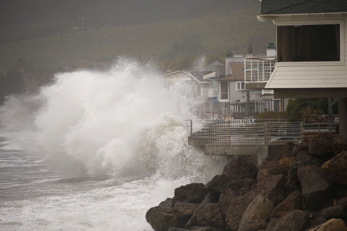 Homes at Mondo's Beach between the Solimar and Faria Beach communities west of Ventura have their sea walls tested Wednesday morning, as the third storm this season's El Nino moves in with more rain and heavy surf.