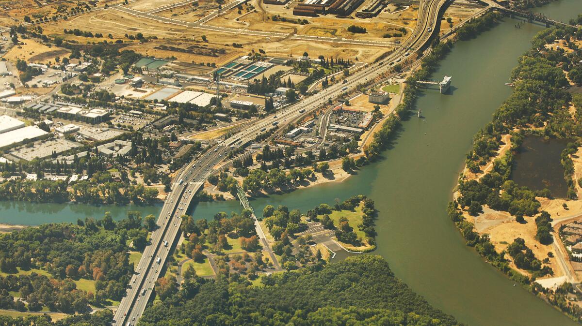 Shown is the confluence of the American River, left, and the Sacramento River, right, in Sacramento.