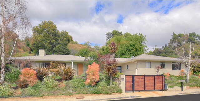 The compound holds a 1940s Midcentury home, a studio, a detached media lounge and a pool house.