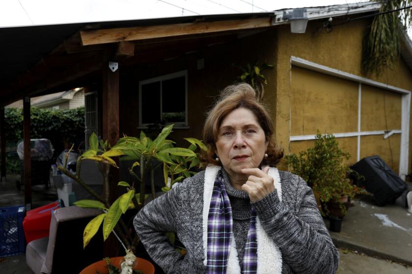 LOS ANGELS, CA FEBRARY 4, 2019: Portrait of Brisas Zapata, 65 outside her garage at her residence in Jefferson Park Los Angeles, CA February 4, 2019. Brisas Zapata hired a contractor to convert her garage into a backyard home. But the contractor is now bankrupt and Zapata is paying a loan, despite no work being done. Brisas along with dozens of other homeowners who took out loans to convert their garages into backyard homes, but the contractor went bankrupt and the work was never started or is unfinished and now they are stuck with loans, sometimes ones they can't afford. (Francine Orr/ Los Angeles Times)