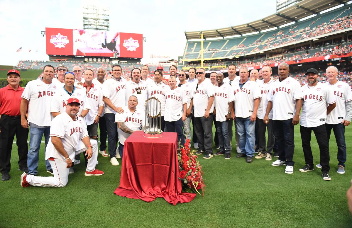 Former Angels players gather at Angel Stadium to celebrate the 20th anniversary of their 2002 World Series title.
