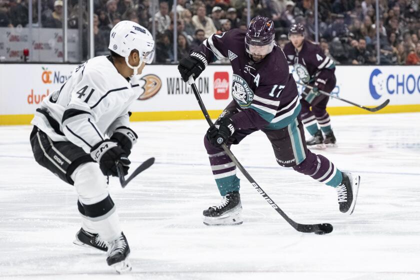 Anaheim Ducks left wing Alex Killorn (17) scores a goal past Los Angeles Kings center Akil Thomas (41) during the third period of an NHL hockey game Tuesday, April 9, 2024, in Anaheim, Calif. (AP Photo/William Liang)