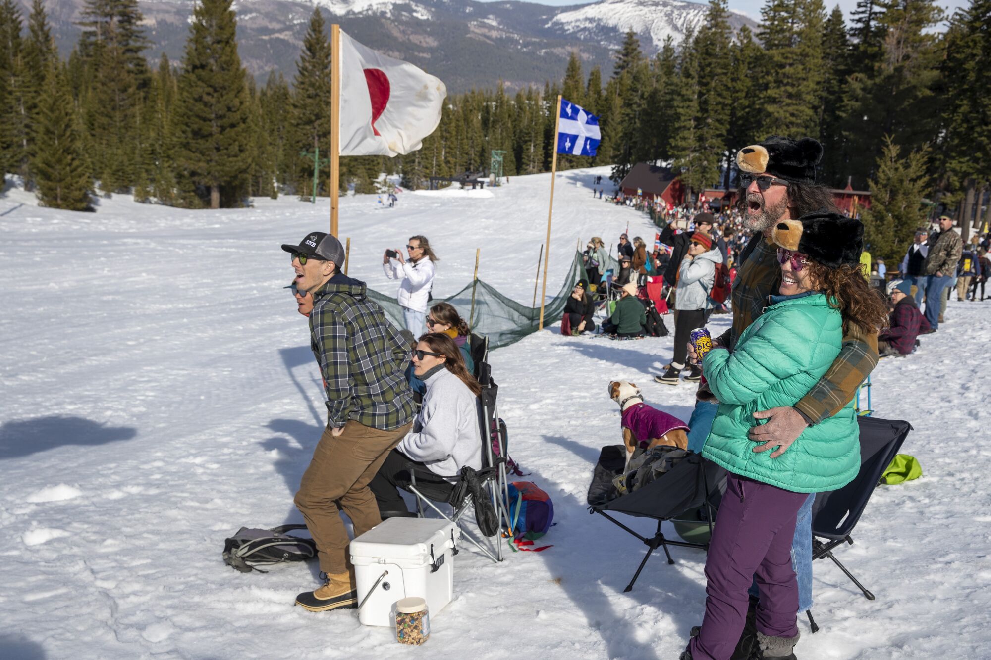 Spectators cheer on ski racers