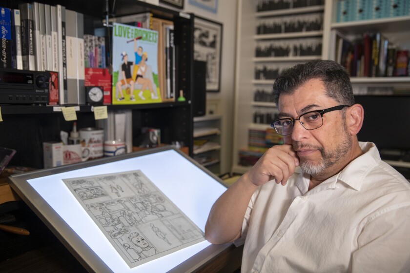 Comics artist Jaime Hernandez in his Pasadena studio. His new book “Is This How You See Me?” is a continuation of a story line that reaches back to the ’80s.