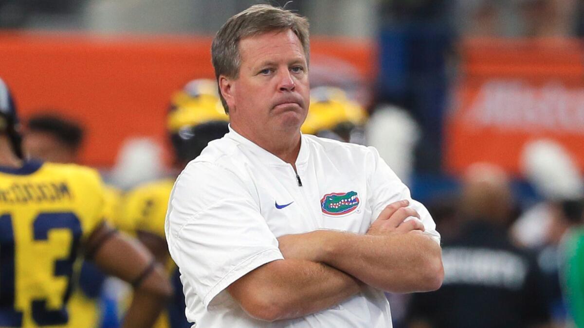 Florida coach Jim McElwain watches his team warm up before a game against Michigan on Sept. 2.