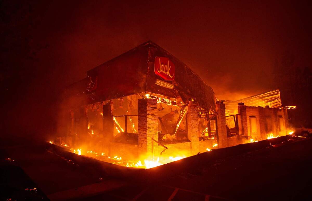 A Jack in the Box fast food restaurant burns as the Camp fire tears through Paradise, north of Sacramento.