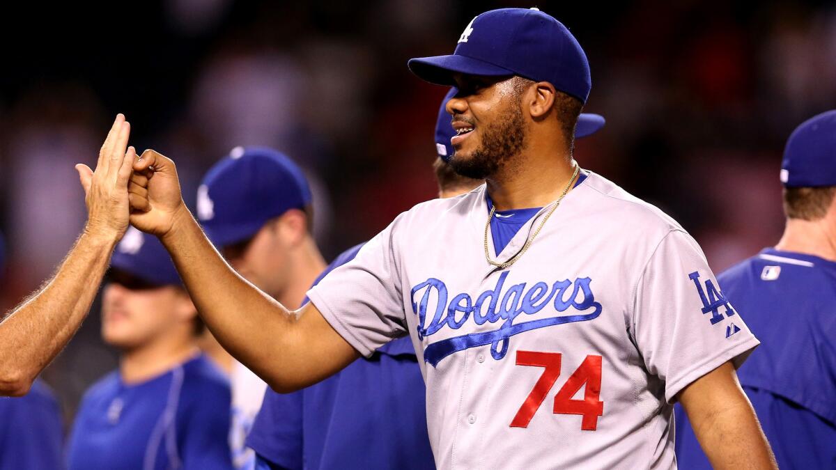 Dodgers closer Kenley Jansen celebrates his 30th save of the season after a 7-5 win over the Angels on Monday in Anaheim.