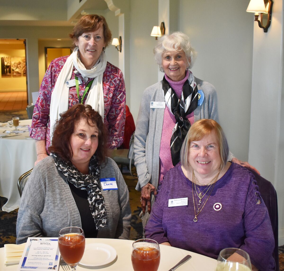 Seated Soroptimists Lauren Chin and Patricia Whitacre. Standing Jan Kane and Judy Horning.