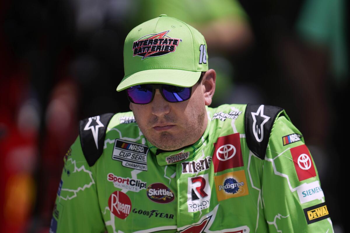 Kyle Busch watches during NASCAR Cup Series auto race qualifying at the Michigan International Speedway in Brooklyn, Mich., Saturday, Aug. 6, 2022. (AP Photo/Paul Sancya)