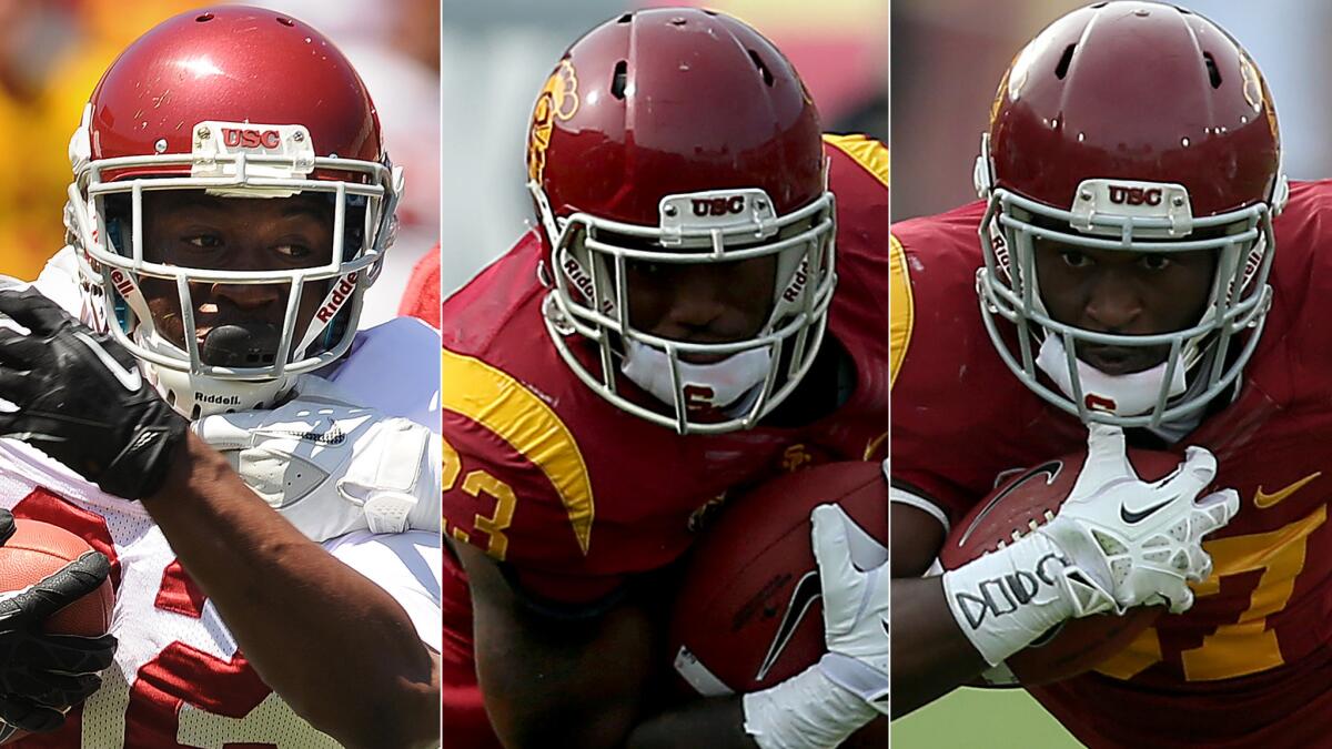 USC running backs (from left to right) Justin Davis, Tre Madden and Javorius Allen are each set to see plenty of carries this season.