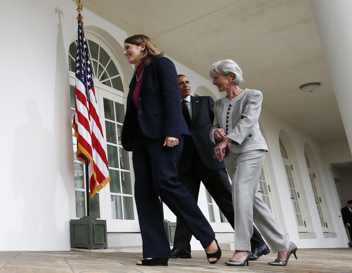 President Obama walks with Sylvia Mathews Burwell, left, whom he has nominated as secretary of Health and Human Services, and Kathleen Sebelius, who is stepping down from that post.