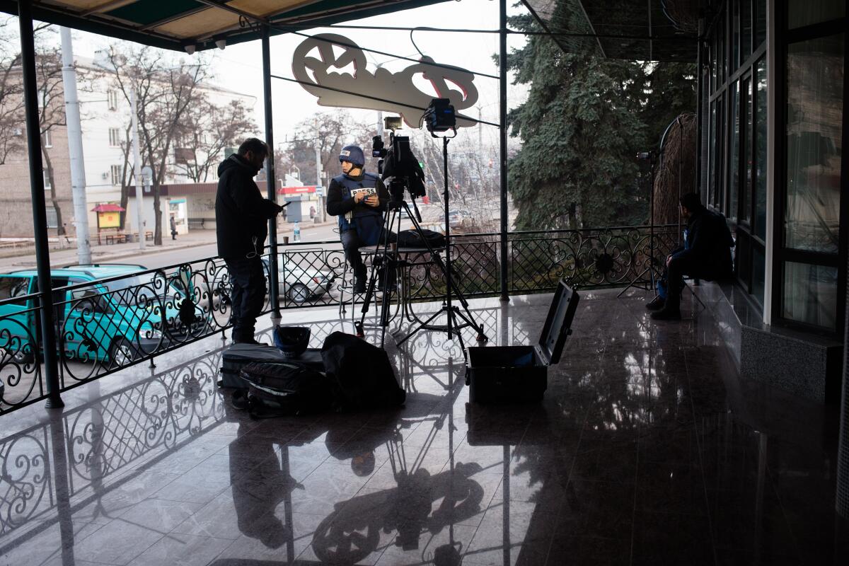 Journalists conduct a live broadcast feed from a hotel in Kramatorsk, Ukraine.