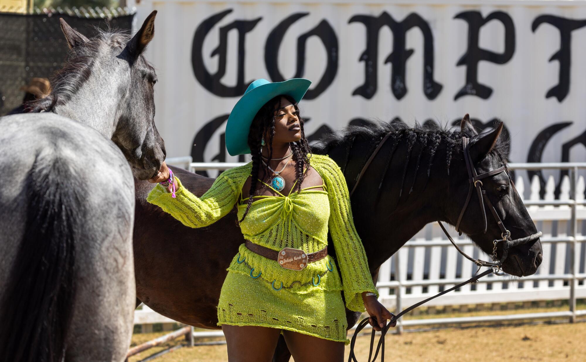 Jadayia Kursh poses for photos with horses in the Compton Cowboy area.