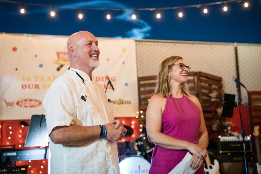 Bill Bracken of Bracken’s Kitchen in Garden Grove stands with his wife, Molly Bracken.