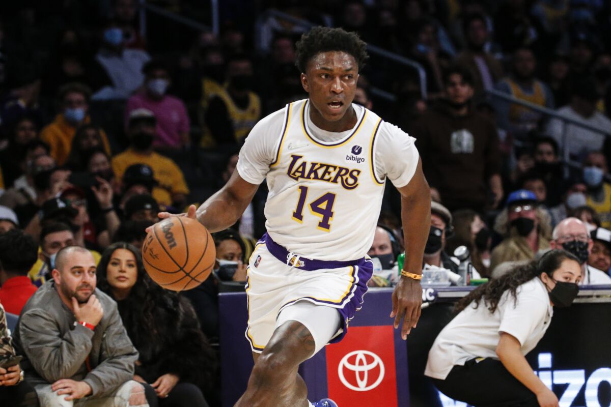 Los Angeles Lakers forward Stanley Johnson (14) drives against the Minnesota Timberwolves.